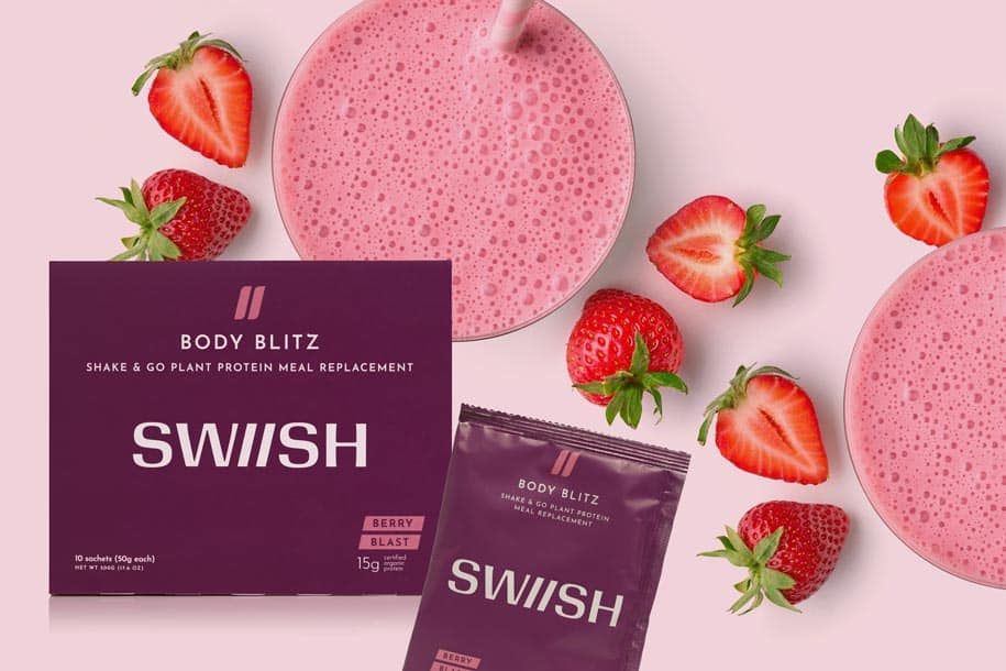 Berry Blast Body Blitz meal replacement shake product box and sachet and blended milkshake